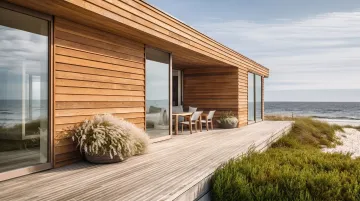 Cedar shiplap siding installed on coastal home exterior with natural wood finish