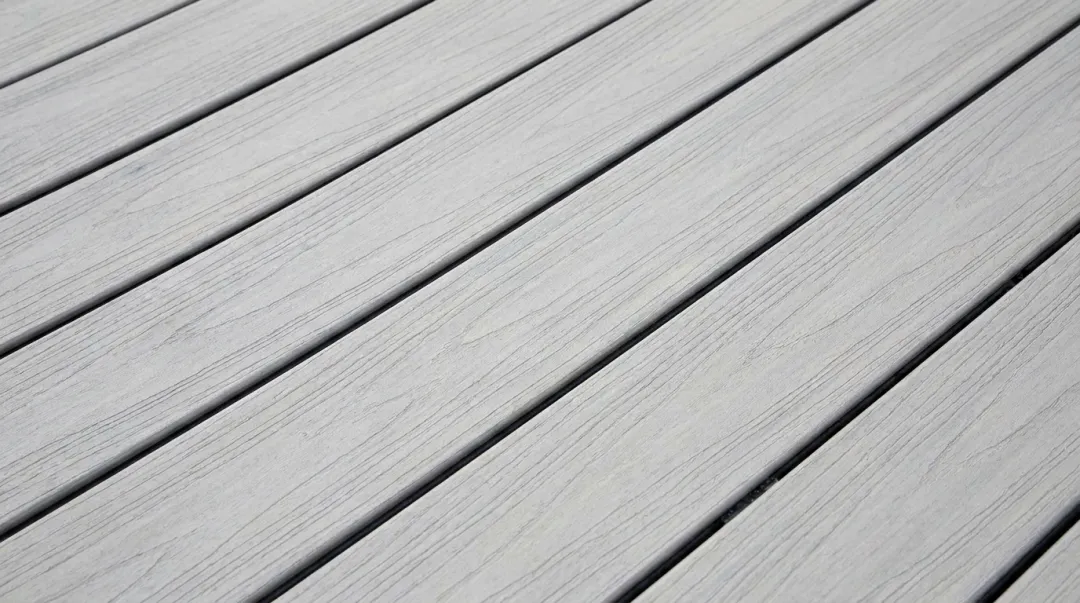 Close-up of composite deck boards showing proper gap spacing between installed boards