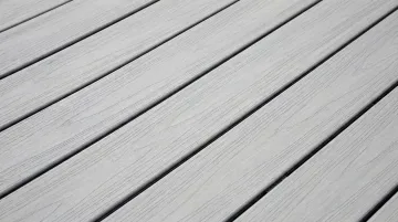 Close-up of composite deck boards showing proper gap spacing between installed boards