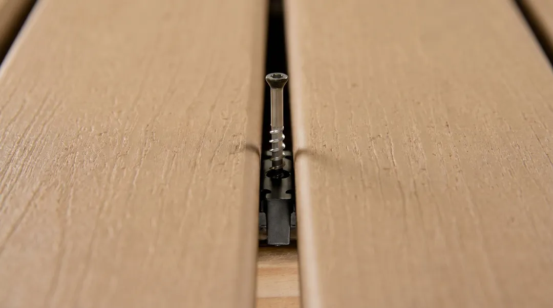 Trex hidden fastener installation showing board gap spacing and hidden clip system