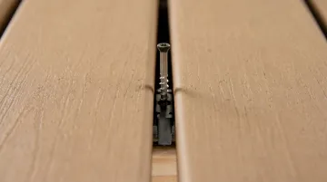 Trex hidden fastener installation showing board gap spacing and hidden clip system