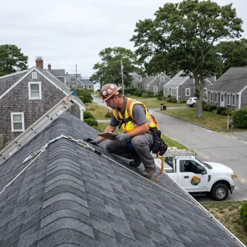 Roofing contractor reviewing asphalt shingle installation