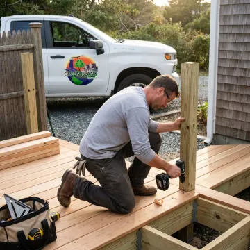 Contractor installing deck railing