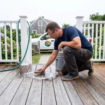 Contractor cleaning a residential deck