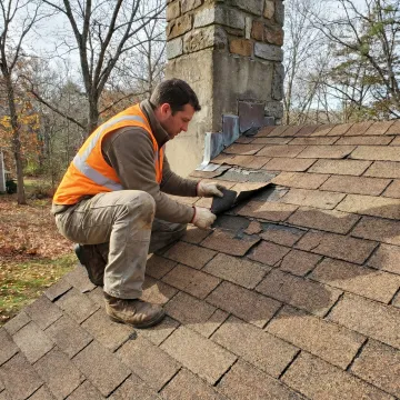 Roof contractor inspecting shingles before repair