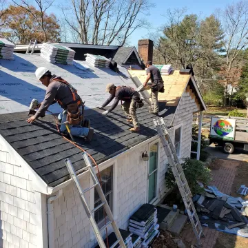 Roof installation contractors working on a home