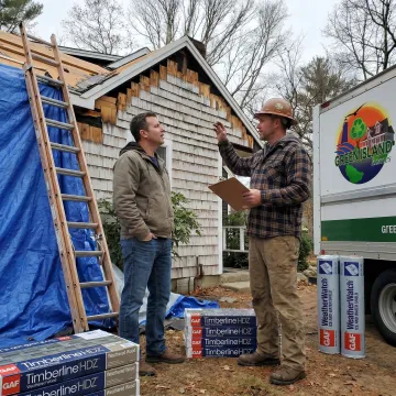 Roofing contractor reviewing roof installation plans