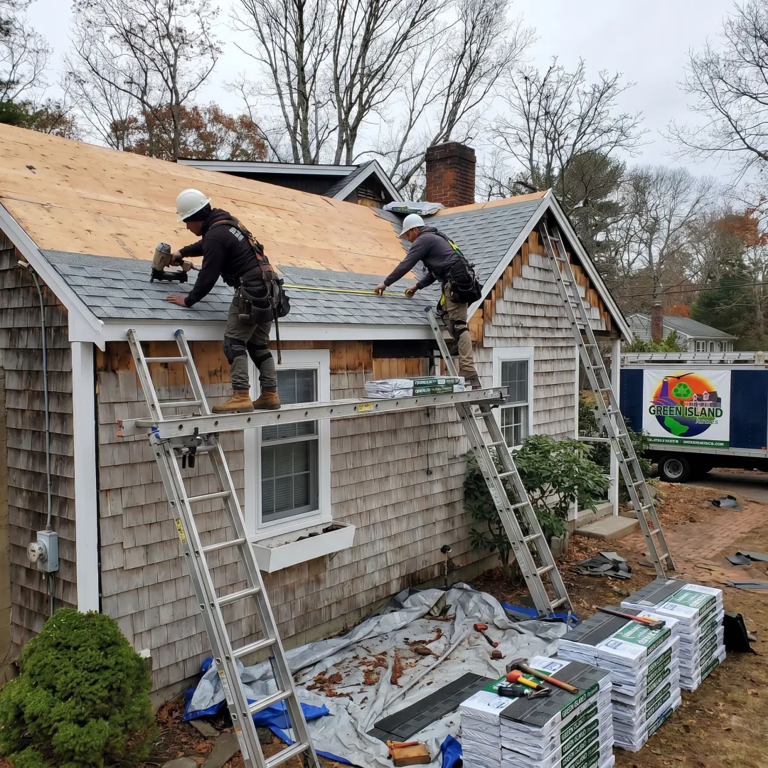 Residential roofing crew working on a coastal home