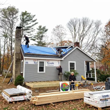 Home renovation contractor working on exterior remodeling