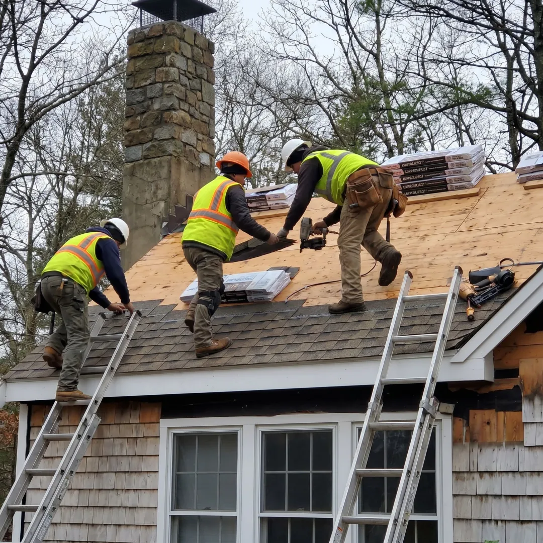 Roofing crew working on a residential home