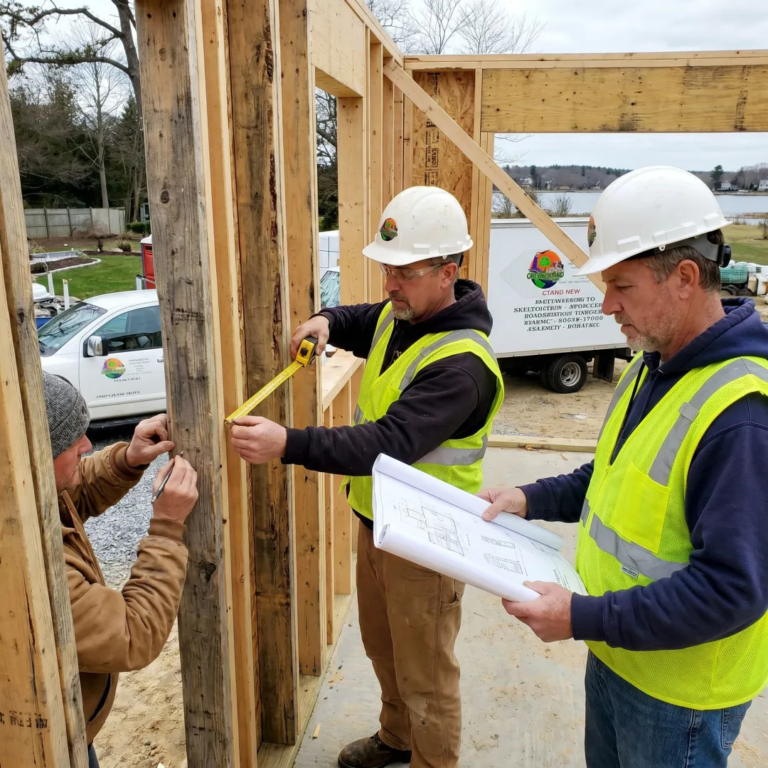Construction team planning a home addition