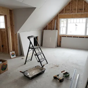 Drywall installation process in a residential remodel