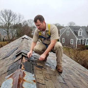 Roofing contractor inspecting storm damage