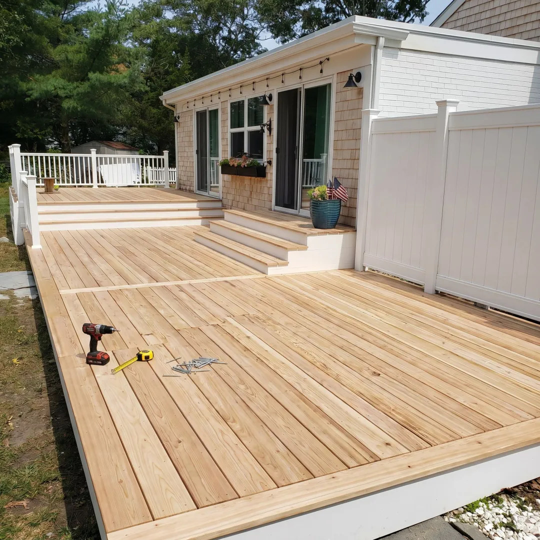 Resurfaced residential deck with clean boards and railings