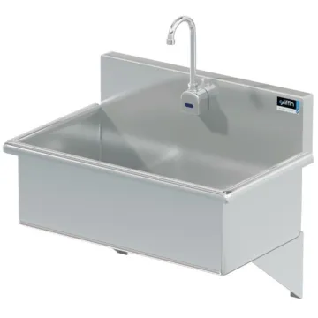 Stainless steel clinical sink in healthcare facility