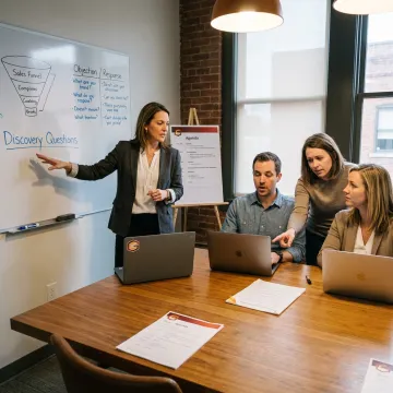 Sales coach training a business team