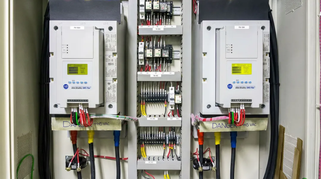 Industrial soft starter unit installed inside NEMA-rated electrical control panel
