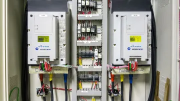 Industrial soft starter unit installed inside NEMA-rated electrical control panel
