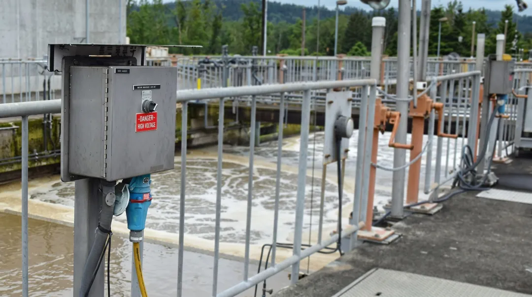 Industrial pump station motor disconnect switch mounted outdoors in NEMA 4X enclosure
