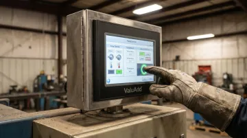 Industrial HMI display with resistive touchscreen operated by gloved operator in plant environment