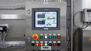 Industrial touchscreen HMI panel mounted inside modern manufacturing control cabinet