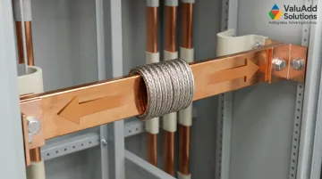 Industrial busbar assembly showing thermal expansion movement absorbed by flexible copper connector