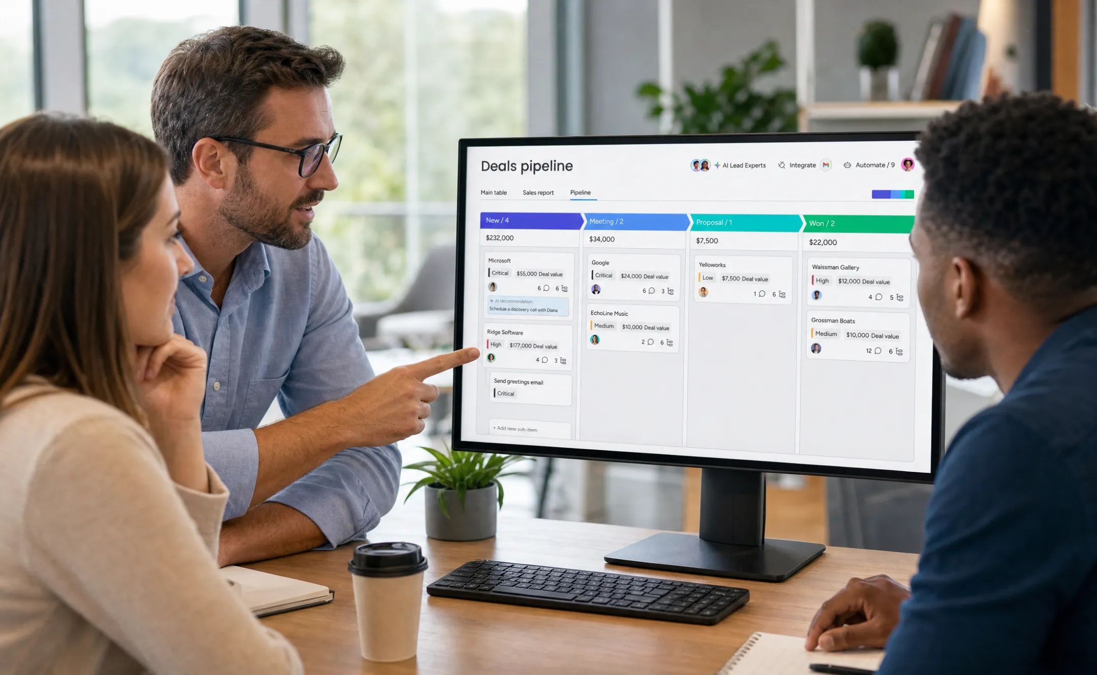 Sales manager reviewing pipeline dashboard with deal stages on screen