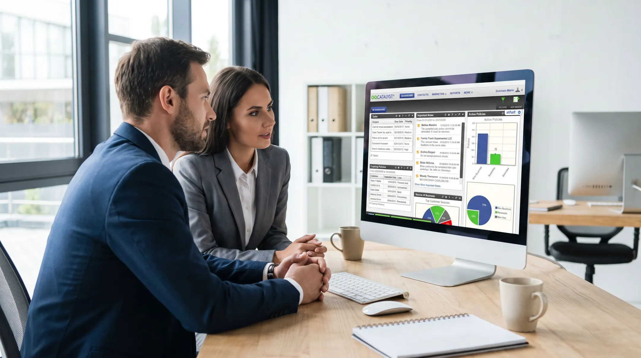 Insurance agency staff using agency management system software interface