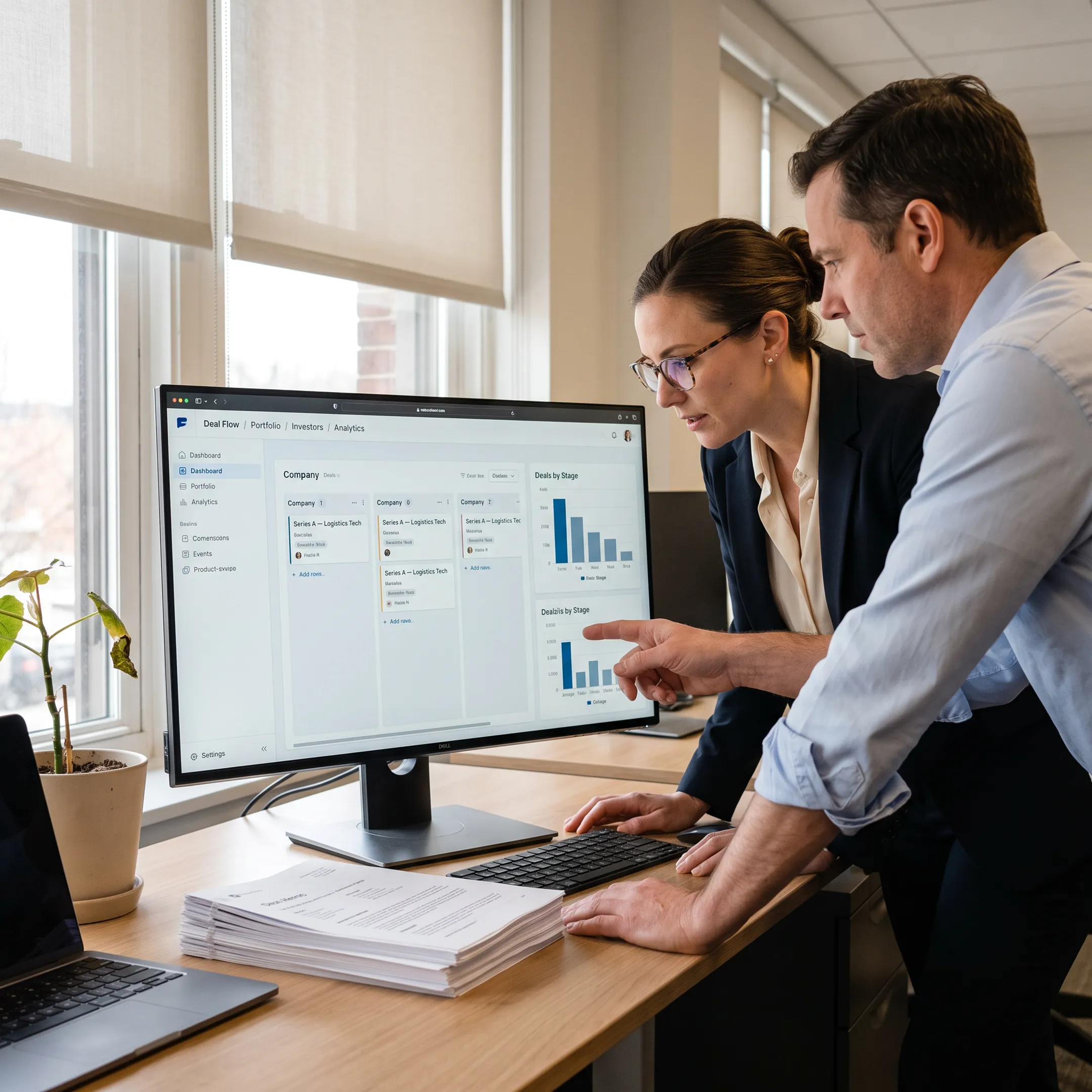Venture capital team reviewing CRM deal flow dashboard