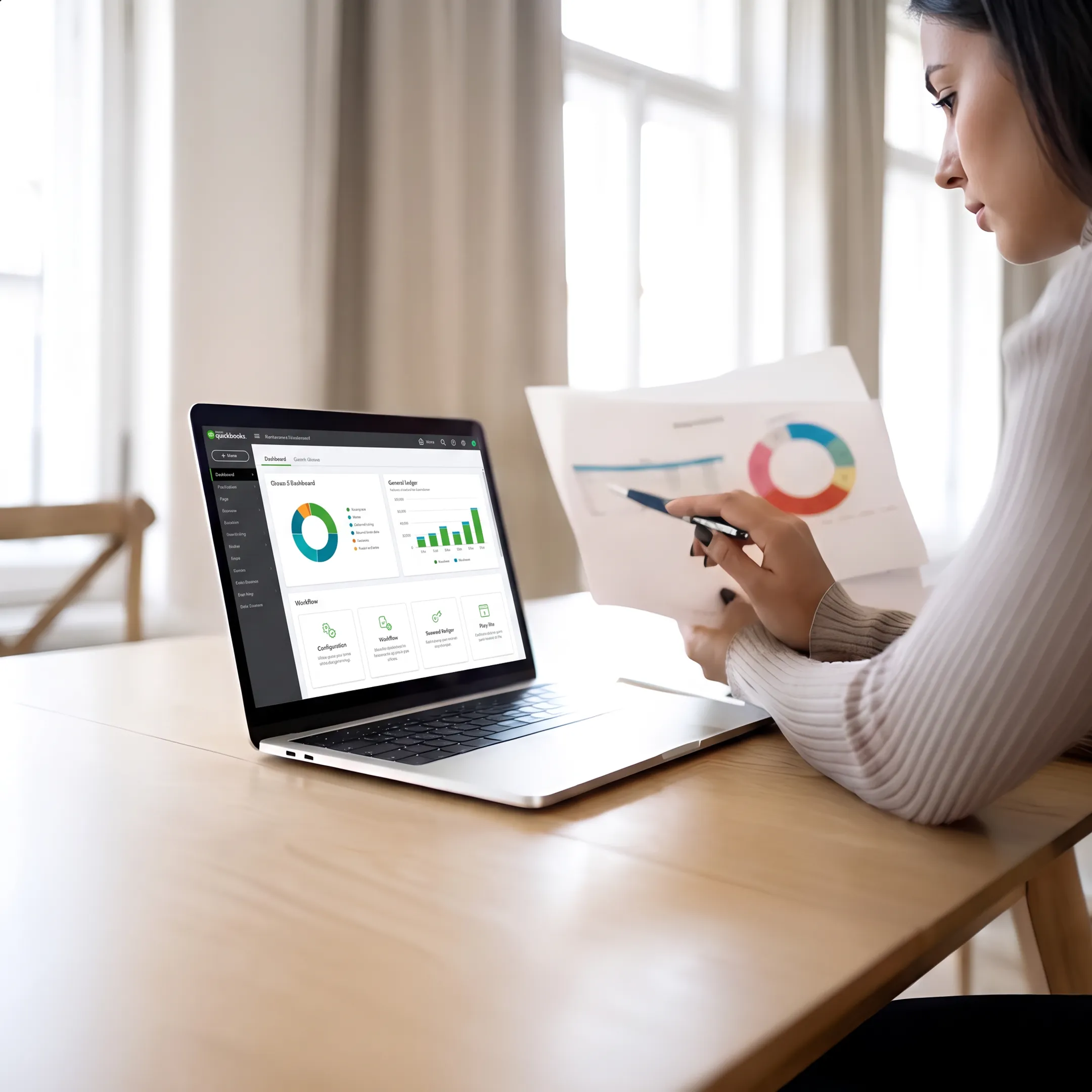 Consultant configuring QuickBooks accounting workflows on a business laptop