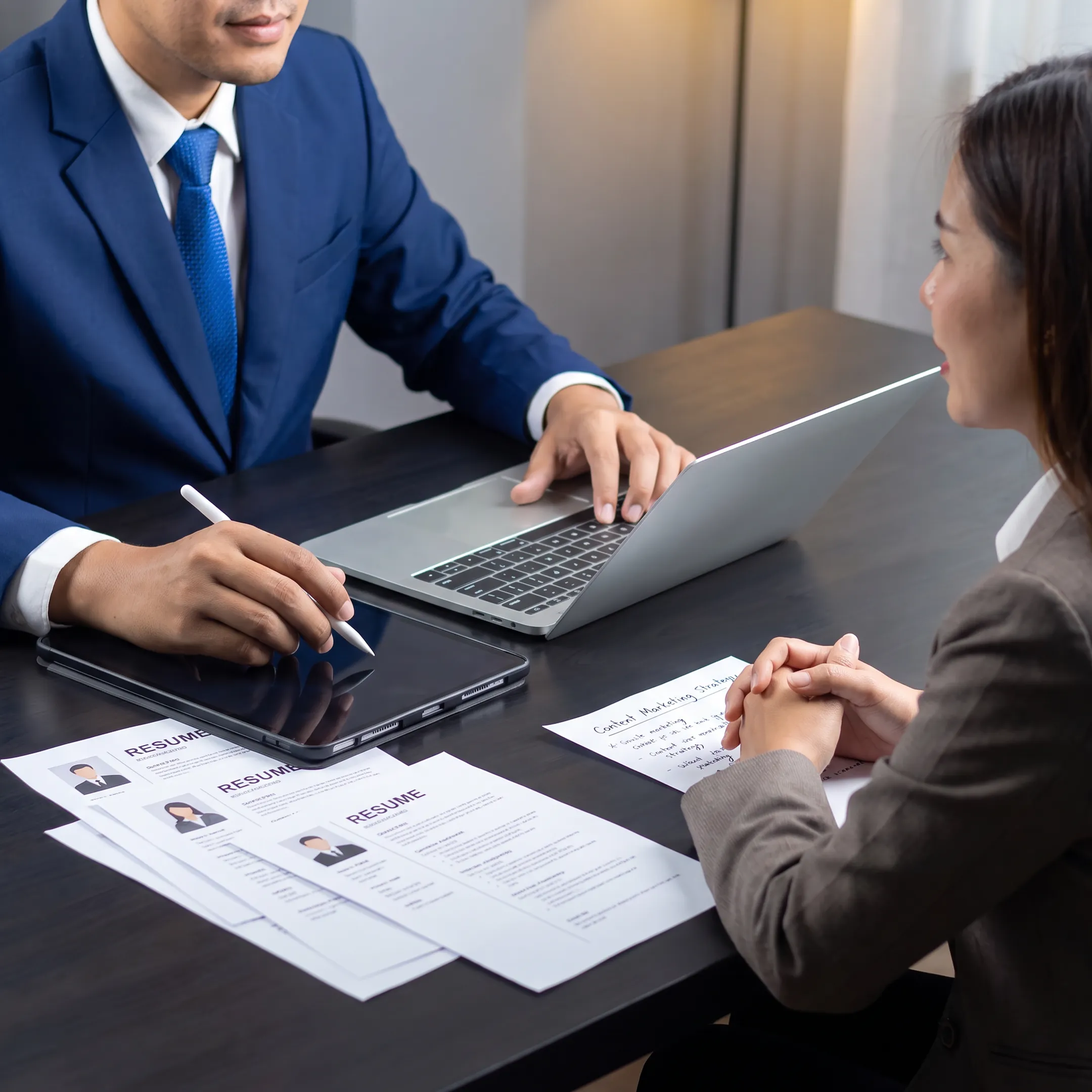 Recruitment team interviewing a content marketing candidate in a professional US office