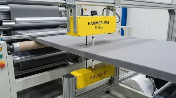 Hammer-IMS M-Ray millimeter-wave sensor measuring nonwoven material on production line