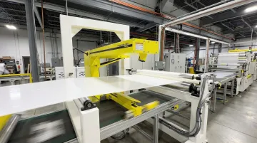 Hammer-IMS M-Ray sensor mounted above industrial production line measuring material moisture