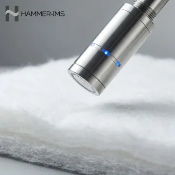 Close-up of M-Ray sensor head measuring thick nonwoven insulation material