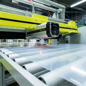 M-Ray sensor head inspecting moving sheet material in industrial production environment