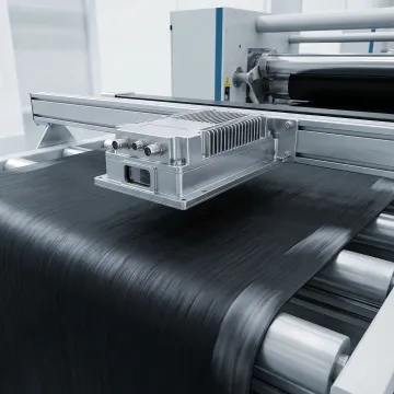 Hammer-IMS M-Ray sensor head mounted on rubber calendering line for inline thickness measurement