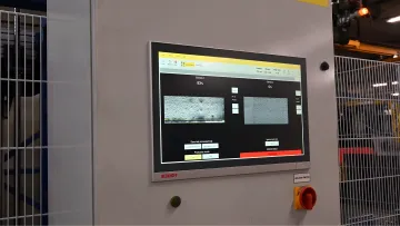 M-Ray sensor head measuring rubber sheet thickness on a production line