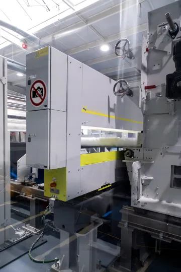 Hammer-IMS technician installing an inline quality control system on a manufacturing mill line