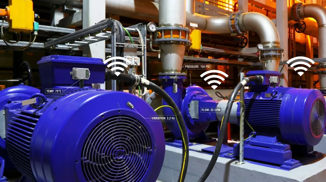 Industrial IoT condition monitoring sensors installed on manufacturing equipment detecting vibration anomalies