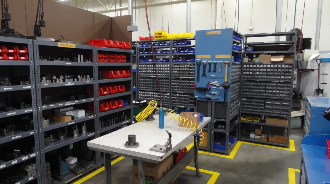 Organized CNC machining workcenter with 5S lean manufacturing principles applied to production floor