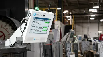 Harmoni RFID machine-side workcenter interface showing operator productivity metrics and job data