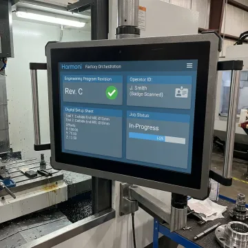 Revision-controlled CNC program loaded at a workcenter