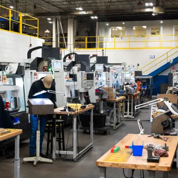 Revision-controlled CNC program loaded at a workcenter