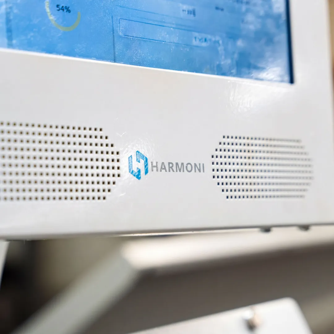 Operator using Harmoni at a CNC workcenter