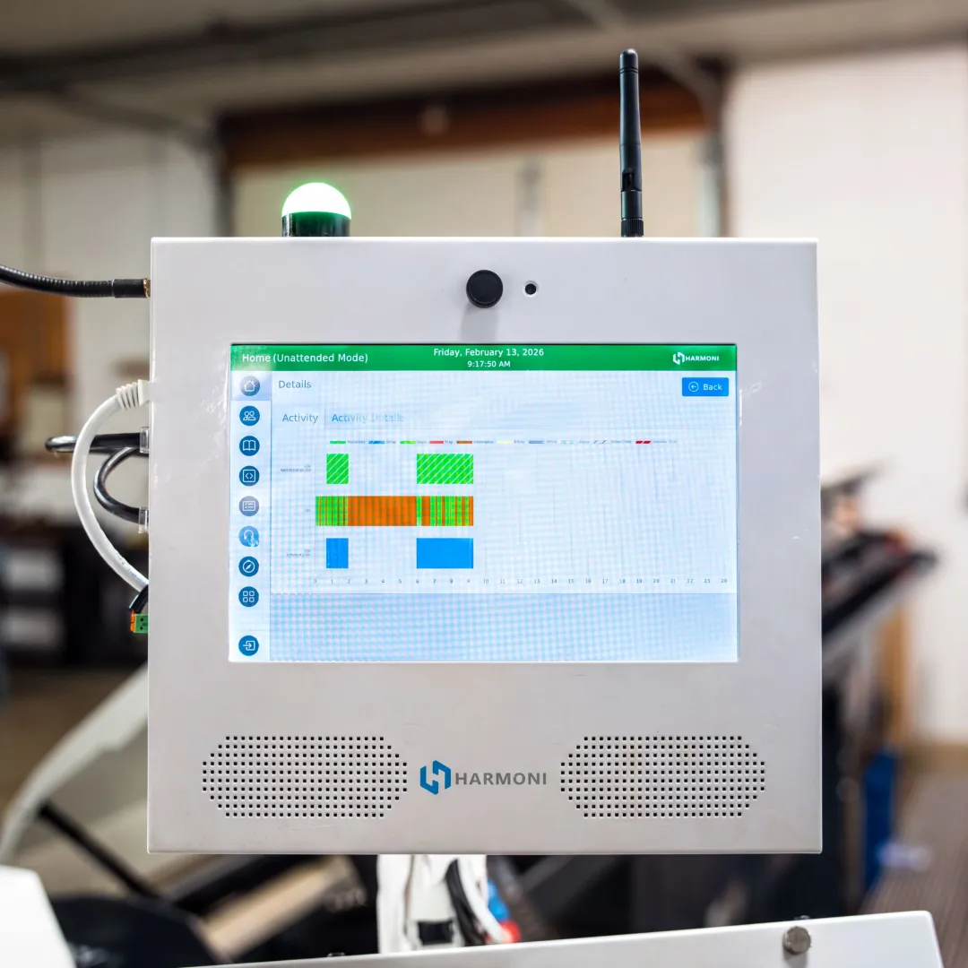 Operator using production optimization software at CNC machine