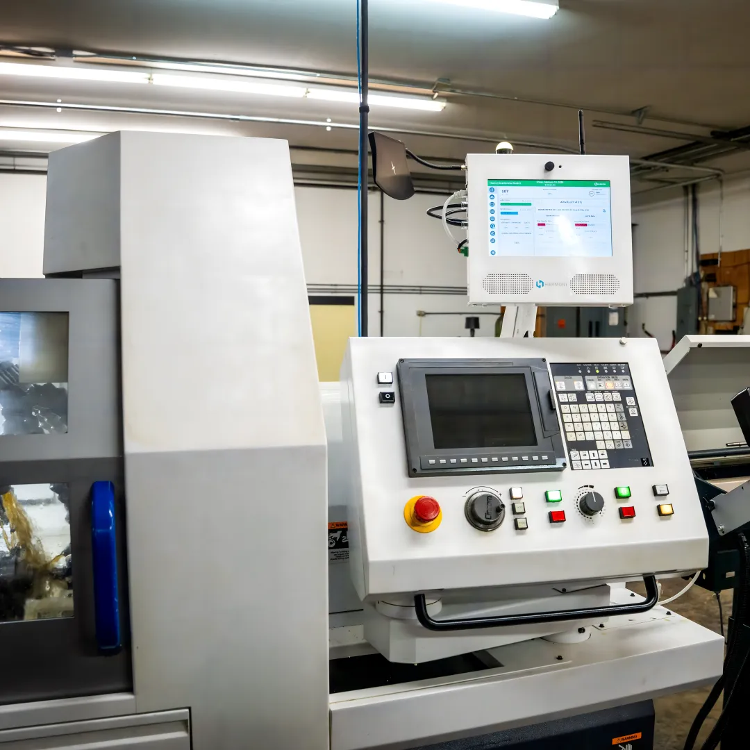 Operator using Harmoni at a CNC workcenter