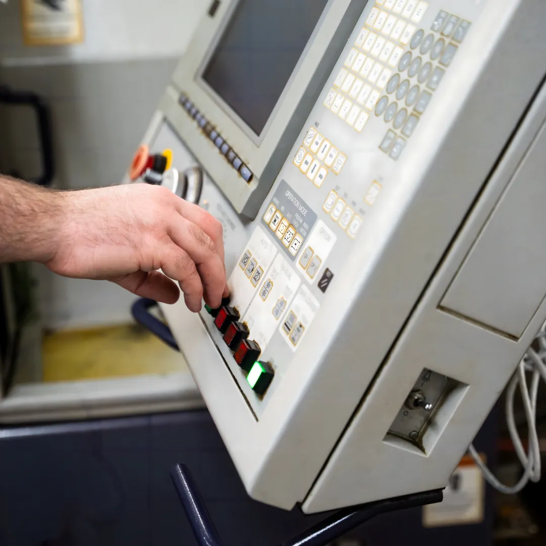 Operator reviewing real-time machine monitoring dashboard