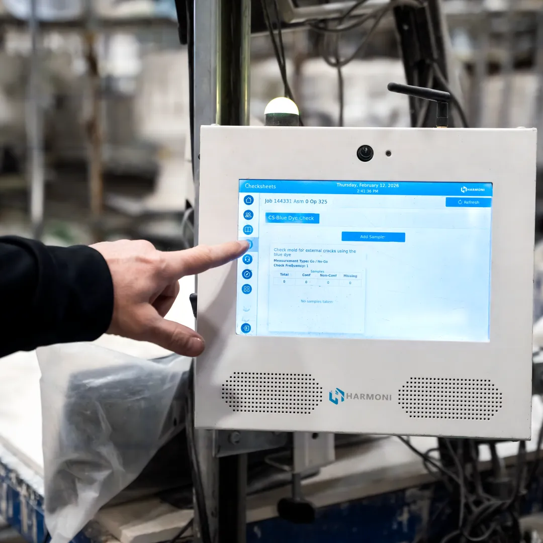 Operator using real-time CNC workcenter interface