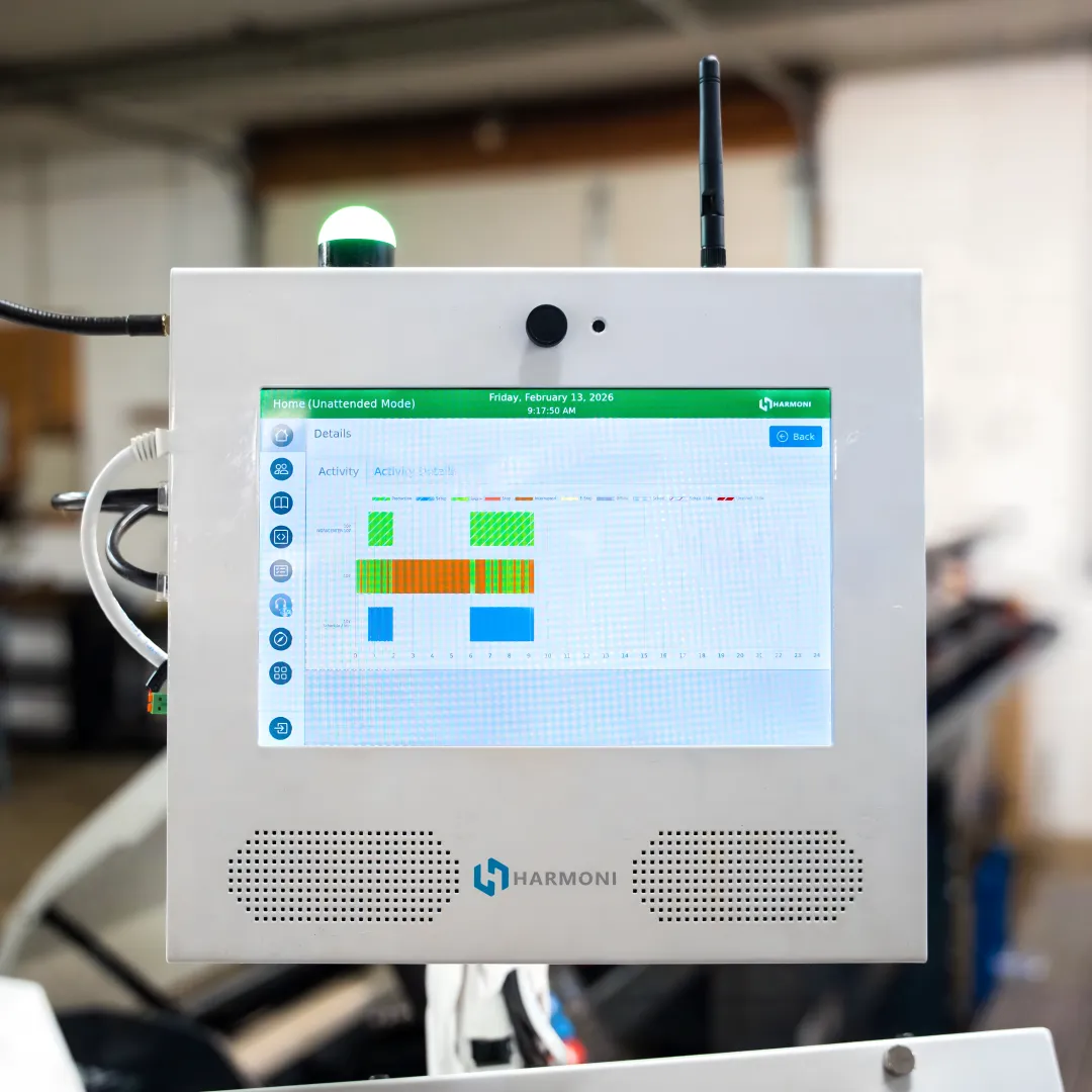 Operator using Harmoni at a CNC workcenter