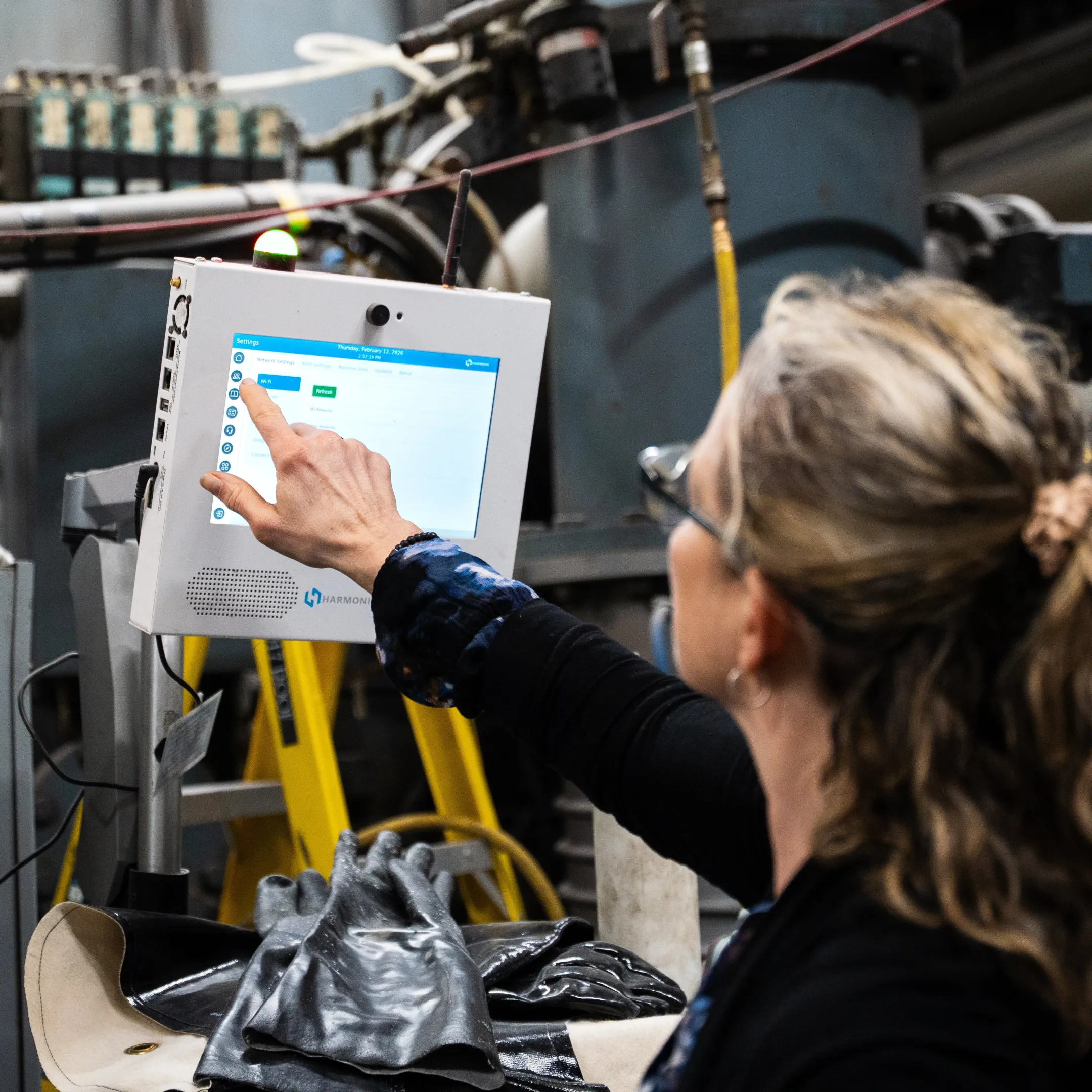 Operator using a digital manufacturing workcenter interface